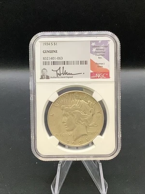 1934 S 34s Peace US Silver Dollar NGC Genuine HAND SIGNED Thomas J Uram Label - Image 1 of 2