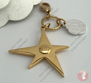 CHANEL Holiday 2025 Kamelie Stern Komet Anhänger Schlüsselanhänger Neuheit Gold Silber - Bild 1 von 2