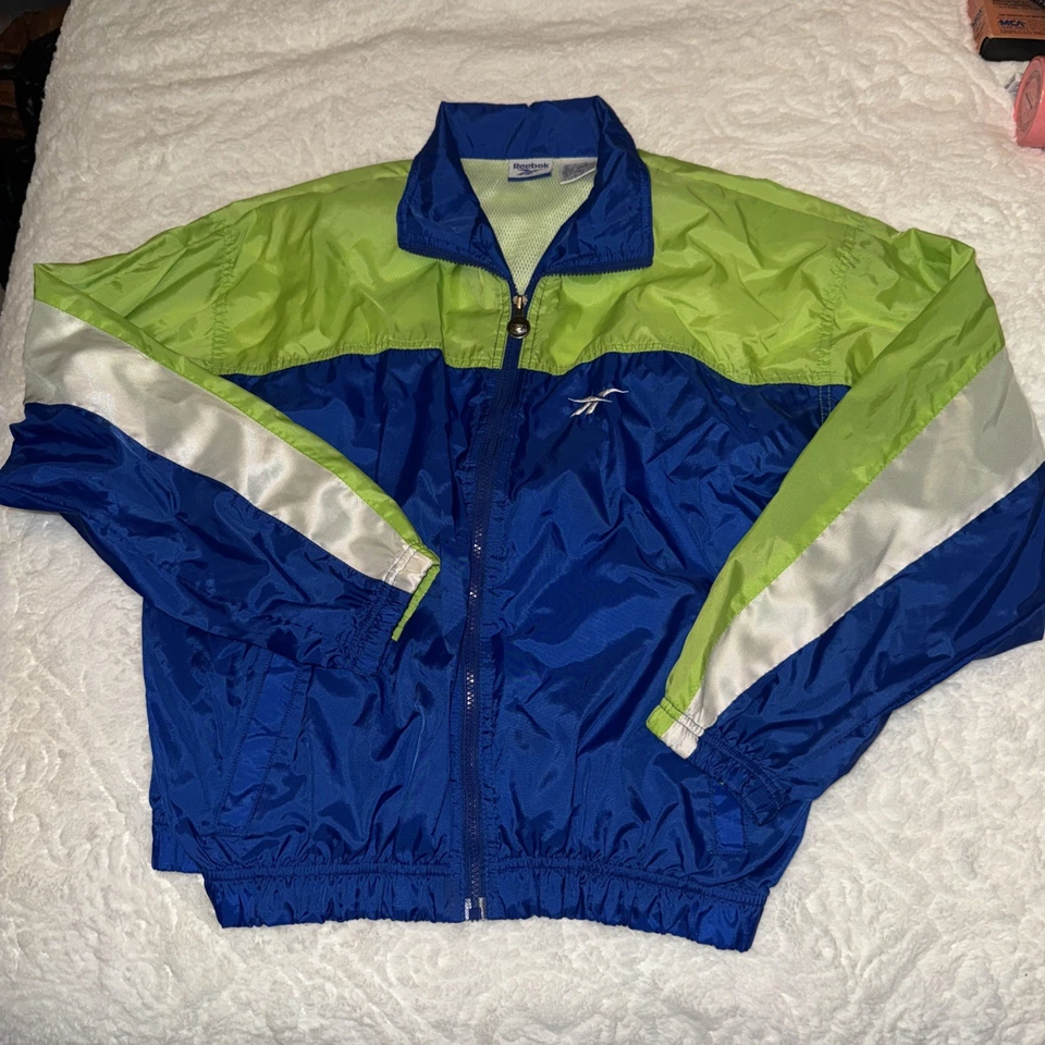 Chaqueta cortavientos vintage Reebok cremallera completa bloque de color años 90 abrigo grande para hombre Foto 1 de 4