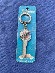 1949 1950 1953 1954 Chrysler NOS AUTOGRAM Ignition Door Lock Blank Key Logo - Picture 1 of 3