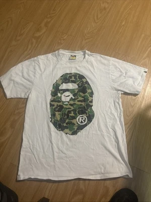 Camiseta BAPE ABC Blanca Camuflada Bebé Cabeza de Milo Verde | Un Mono de Baño | Talla L Foto 1 de 4