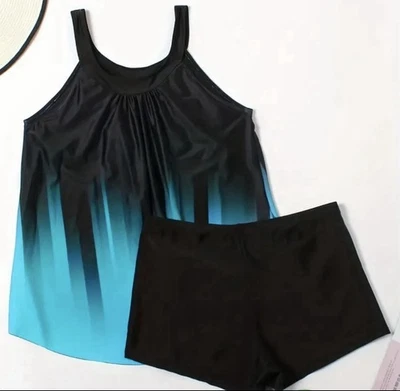 Traje de baño tankini de dos piezas. Top estampado a rayas negro/azul, pantalones cortos negros para niño. Talla 0XL Foto 1 de 4