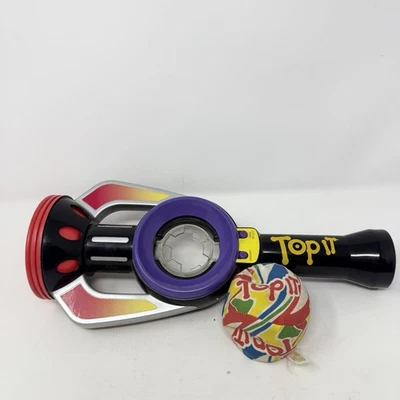 Juego portátil electrónico Top It con pelota de Parker Party Bop It Hasbro Foto 1 de 4