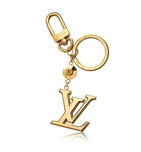 Neu mit Etikett Louis Vuitton LV Schlüsselanhänger M65216 Facetten Gold Taschenanhänger Unisex Klassiker - Bild 1 von 8