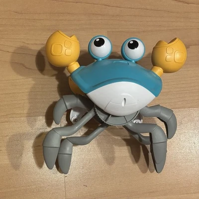 Juguete de música de cangrejo gateador Foto 1 de 2
