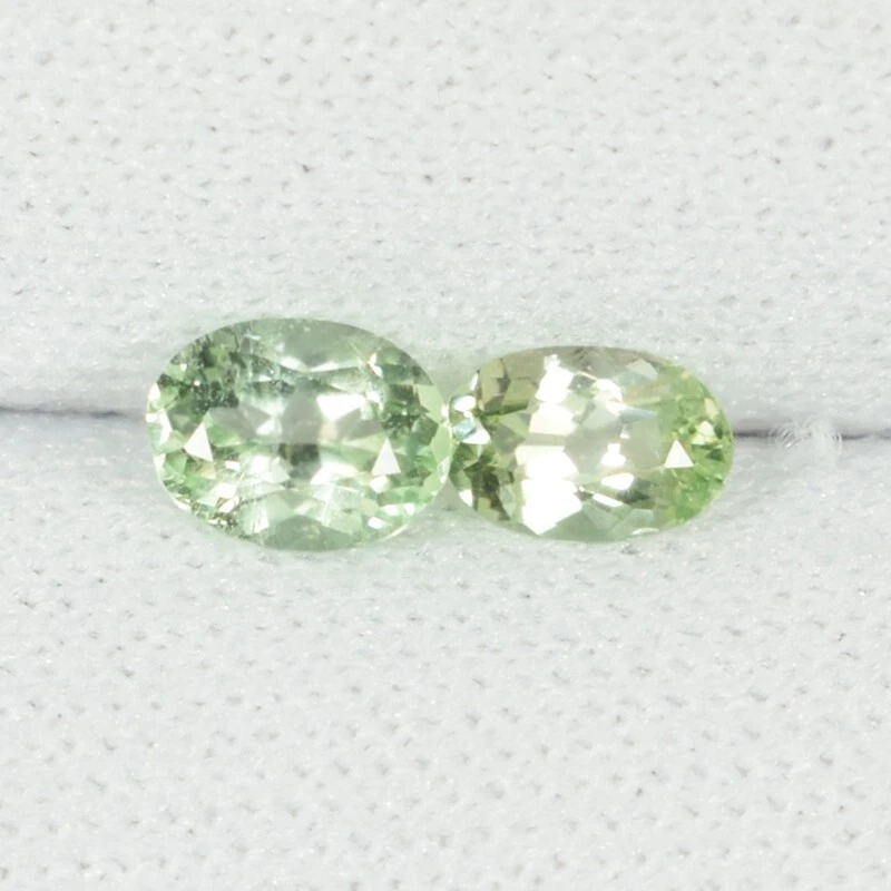 0.60 ct RARE COLLECTOR'S MINT GREEN NATURAL KORNERUPINE  Oval 2pc See Vdo ON - Image 1 of 3