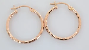 Diamond Cut Huggie Hoop Earrings in 14k Rose Gold - Picture 1 of 3