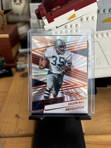 2025 Panini Revolution Calvin Hill #7 Dallas Cowboys SUNBURST /18 - Bild 1 von 2