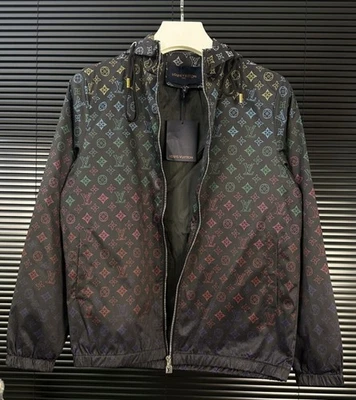 Chaqueta cortavientos unisex con capucha Foto 1 de 4