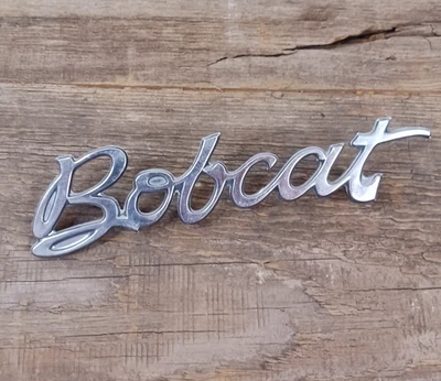 1975 Mercury Bobcat Chrome Fender emblema script emblema fabricante de equipamento original #D5yb16b114aa - Imagem 1 de 4