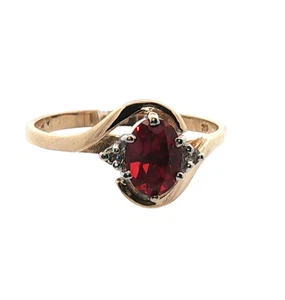9ct Gold Ring Featuring Oval Crafted Ruby with Diamond Accents - Picture 1 of 19