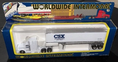 Tractor fundido a presión CSX 1:48 intermodal en todo el mundo sin abrir + contenedor + chasis Foto 1 de 4
