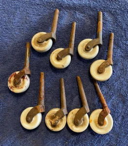 Lot of 9 - Antique White Porcelain Caster Wheel, 2-3/4" Iron Stems, 1-1/2" Wheel - Picture 1 of 7