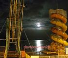 PHOTO  THE BEACH HELTER SKELTER AT CLEETHORPES BATHED IN MOONLIGHT A HIGH TIDE A