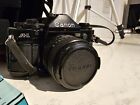 Canon A-1 35mm SLR Film Camera - Black with lots of accessories 
