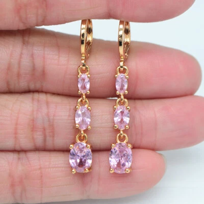 Pendientes colgantes de topacio místico azul ovalado de moda rellenos de oro amarillo de 18 quilates para mujer Foto 1 de 4