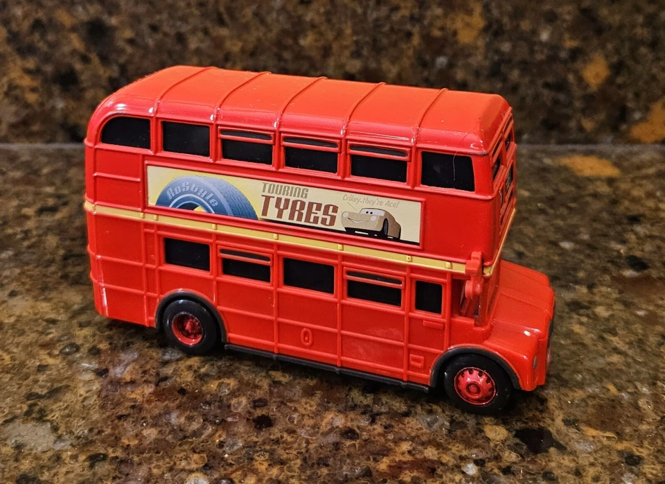 Disney Pixar Cars Fly The United Kingdom Car Trafalgear 91 Figura Diecast Bus Foto 1 de 4