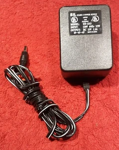 E30) Sil Power Adapter #UD-1315. Output: DC 13V, 1.5A, 5.5mm x 2.1/2.5mm Plug. - Picture 1 of 2