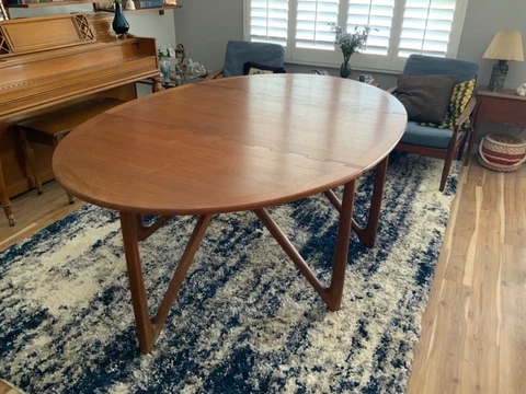 Danish teakwood dining table by designer Niels Kofoed Cover