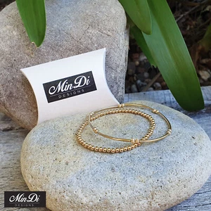 Juego de dos pulseras elásticas rellenas de oro amarillo de 14 K. - Imagen 1 de 4