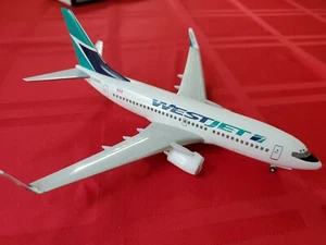Hogan Wings Westjet C-Fiws 737-700W 1/200 mit Getriebe mit Box mit Ständer - Bild 1 von 12