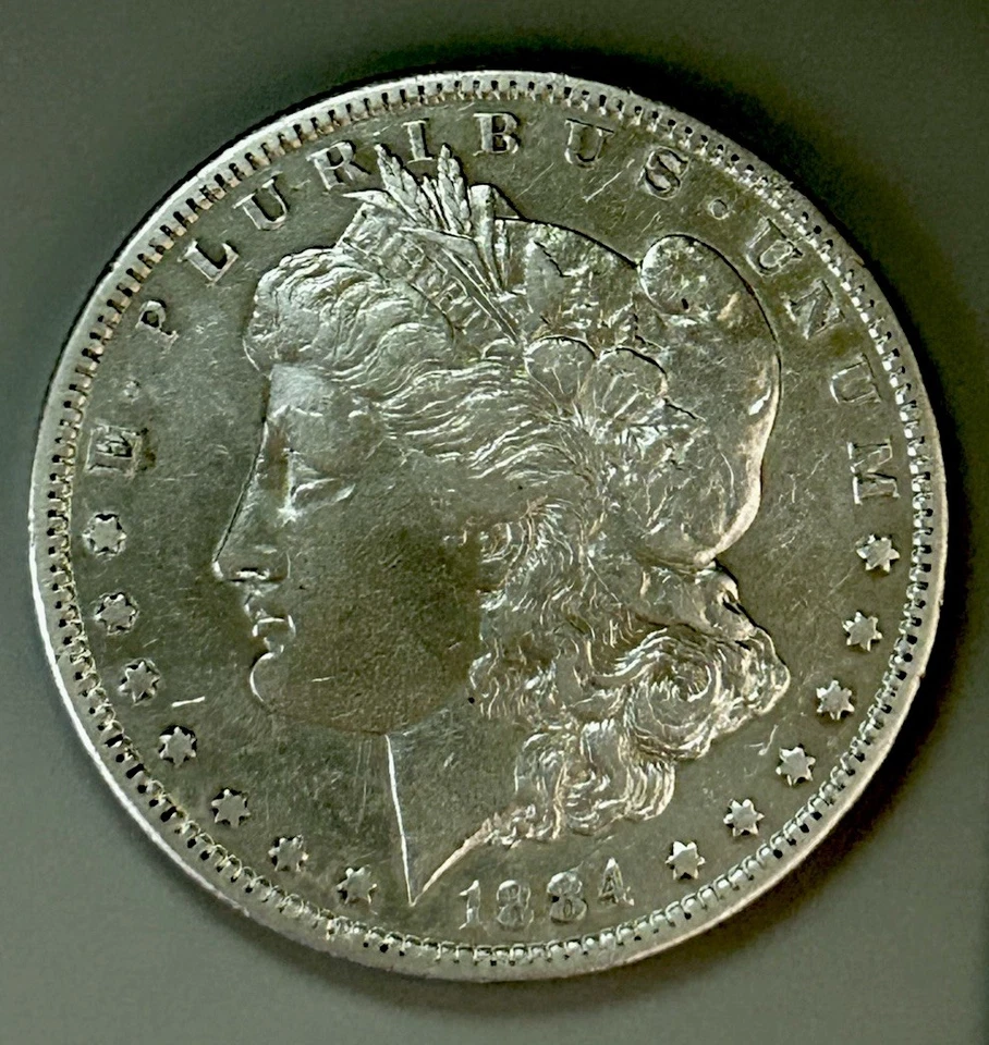 Dólar de plata Morgan 1884-S $1 AU mejor fecha ~ 25618 Foto 1 de 2