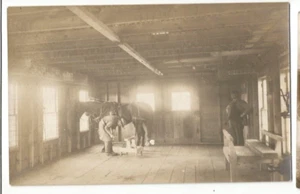 RPPC BLACKSMITH SHOP HORSESHOEING OCCUPATION REAL PHOTO POSTCARD HORSE BARN - Picture 1 of 1