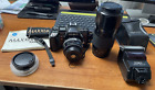 MINOLTA MAXXUM 7000i CAMERA with Two MINOLTA AF Lenses, Flash, Manuals & Bag