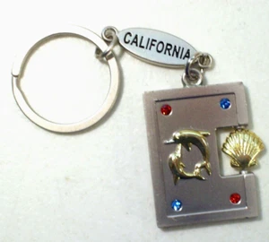 Llavero de metal Spinning Seashell California Dolphins - Imagen 1 de 3