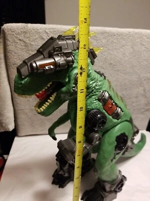 Juguete dinosaurio T Rex 14" luces y sonidos. No camina para piezas falta mando Foto 1 de 4