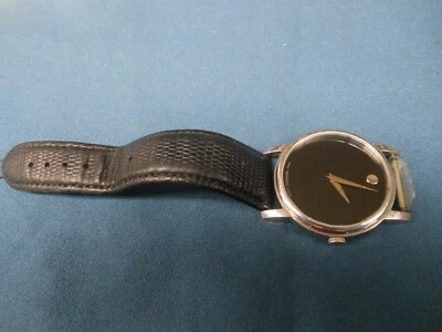 Reloj de pulsera Movado 39 mm 01.1.14.6000 esfera negra museo para hombre necesita batería Foto 1 de 4
