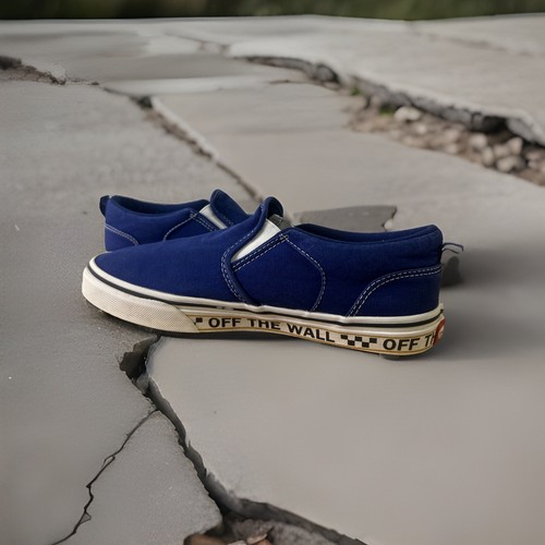 VANS Slip on giovanile "Fuori dal muro" blu tinta unita a scacchi con bordo 7