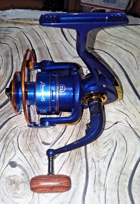 Carrete giratorio SOUGAYILANG serie FH6000 12B's relación 4,9:1 carrete de aluminio con zócalo Foto 1 de 4