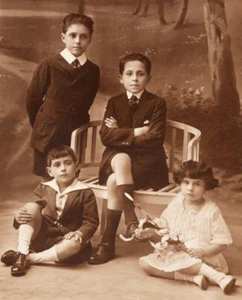 FOUR ELEGANTLY DRESSED CHILDREN : BIXIO STUDIO : BUENOS AIRES : RPPC  1920's - Picture 1 of 3