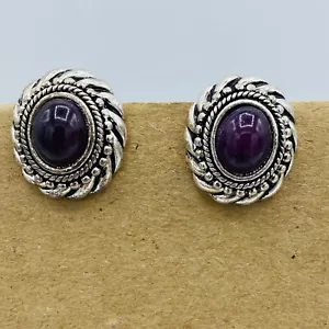 Avon clip on earrings with dark purple center and silver colored surround. - Picture 1 of 4