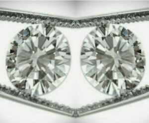 2 = .06ct Diamond parcel. G/SI. 2 Round Brilliant Cut diamonds.