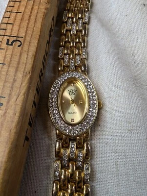 Reloj pulsera EJ Ernest Jones para mujer, tono dorado con cristales blancos, moda  Foto 1 de 4