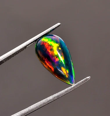 Натуральный черный эфиопский опал 2,5 карата в форме груши драгоценный камень россыпью 16X8X4 мм - Изображение 1 из 4