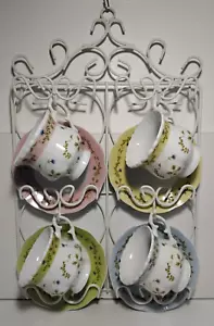 Set of 4 Floral Teacups and Saucers on a white metal hanging rack - Picture 1 of 6