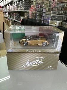 PAGANI IMOLA GOLD FULL CARBON WITH EXTRA WHEELS 1/64 DIECAST CAR BY CM MODELS - Picture 1 of 14