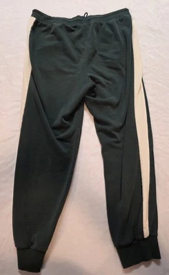 Pantalones deportivos Puma para hombre pequeños con logotipo en relieve bolsillos con cordón verdes Foto 1 de 4