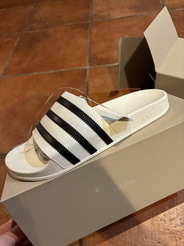 Taglia 10 Scivoli Adidas Fear of God Athletics Adilette bianco crema IH2272