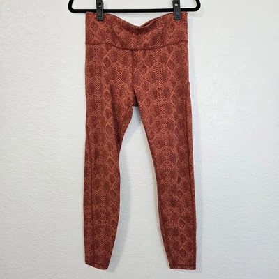 Leggings Athleta com estampa de cobra Ultimate Stash bolso 7/8 altura laranja Athleisure - Imagem 1 de 4