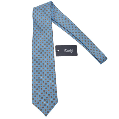 Corbata Drake's nueva con etiquetas azul claro con mini estampado geométrico naranja y blanco 100 % seda Foto 1 de 4