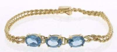 Ladies Genuine Blue Topaz Bracelet in 14 Kt Yellow Gold Foto 1 de 3