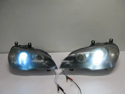 07-2010 JUEGO FAROS CONDUCTOR PASAJERO BMW X5 PAR HID AFS Foto 1 de 4