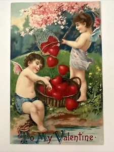 Geprägte Valentinstag Postkarte Amor Cherub fangen Herzen Korb Deutschland - Bild 1 von 2