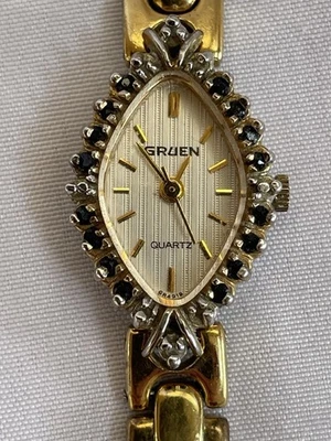 Gruen女式石英正装手表黑色口音光环表圈金色全新电池 — 第 1/3 张图片