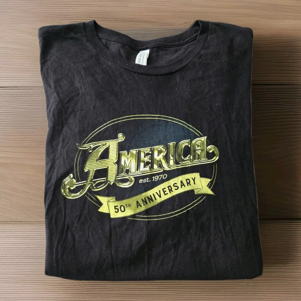 AMERICA Band Est. Camiseta negra 1970 "50 aniversario" talla 2XL rock clásico usada en excelente estado Foto 1 de 4