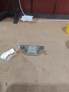 1984-1986 CORVETTE REAR LICENSE PLATE LIGHT 16509352 Excellent Original - Picture 1 of 3